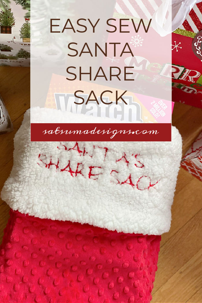 Photo of red and white large scale stocking under a Christmas tree