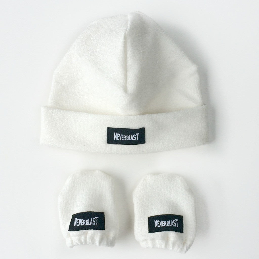 white baby hat and mittens