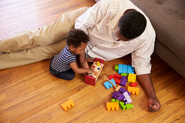 Dad playing with blocks with 10 month sleep regression