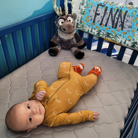 baby laying in crib