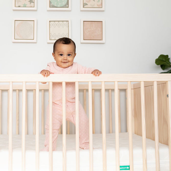 9-month-old milestones standing up in crib