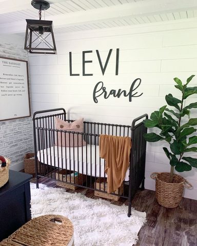 baby boy nursery with the name Levi Frank on the wall