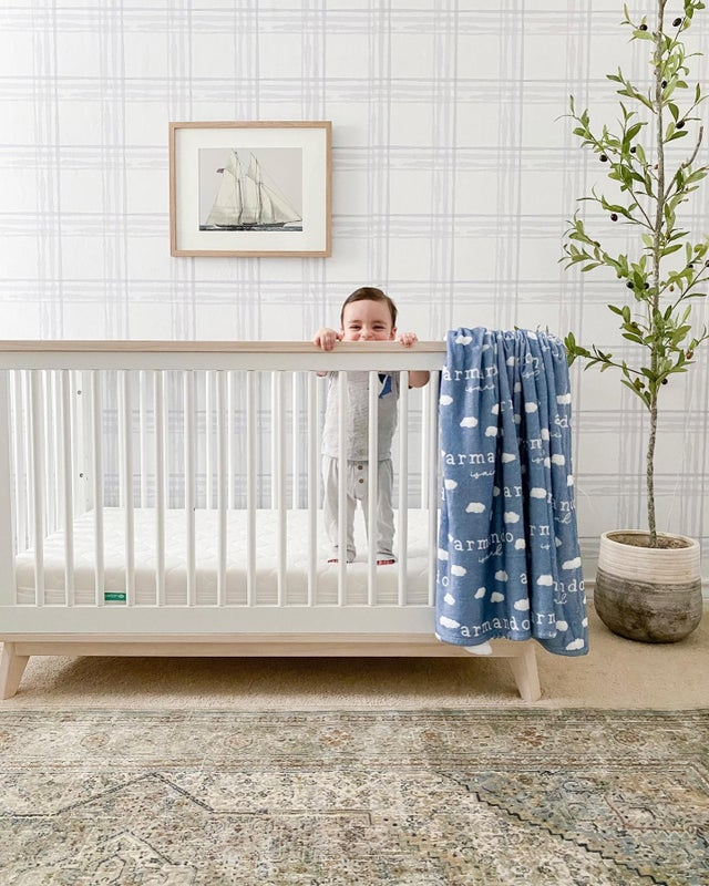 Baby standing in crib