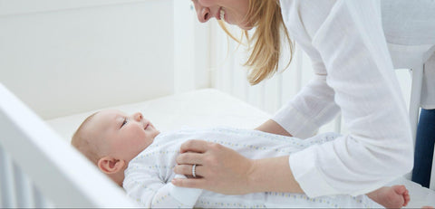 Mom helping baby with baby sleep regression