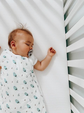 baby sleeping on breathable crib mattress