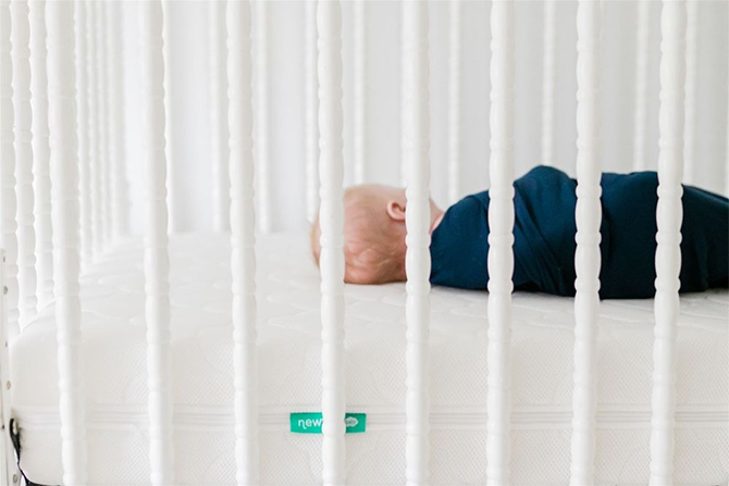 Up close of sleeping baby in crib