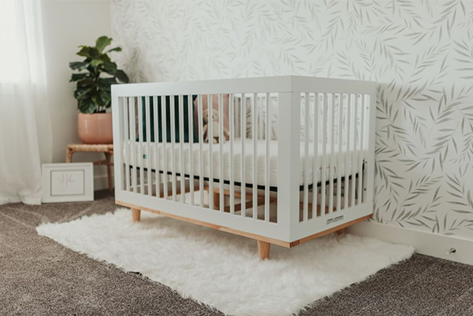 white crib in a nursery