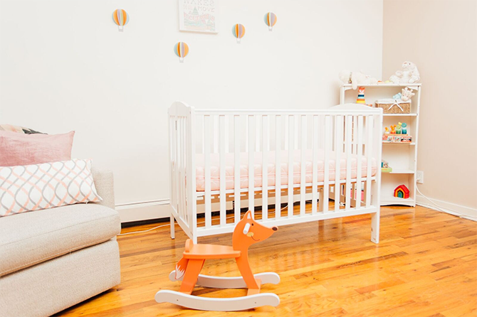 baby room with crib and rocking horse