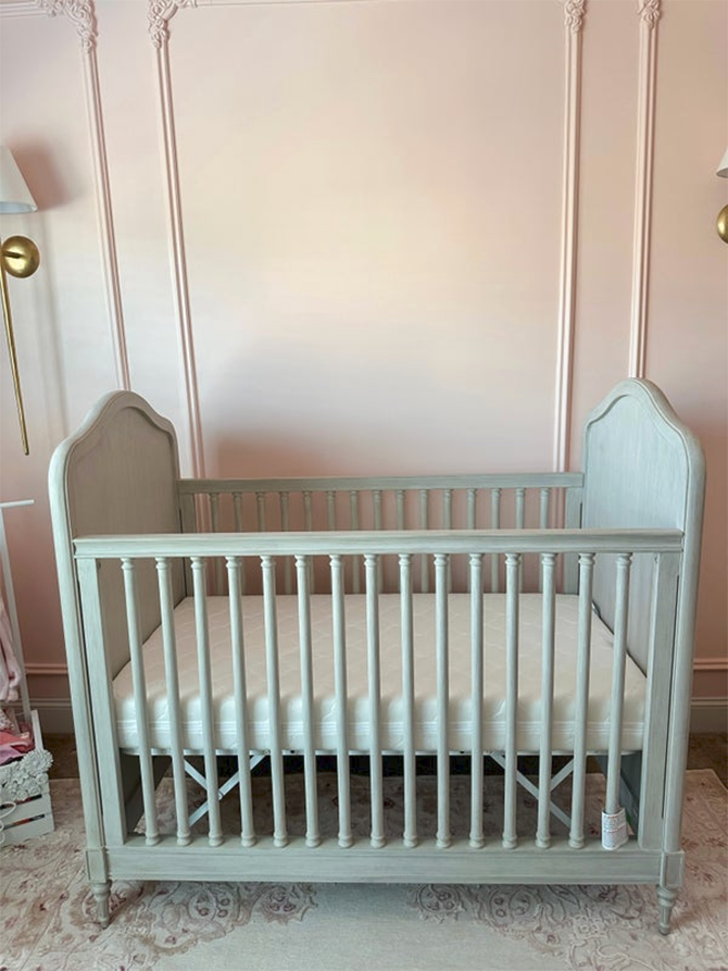 crib mattress in a mint green crib