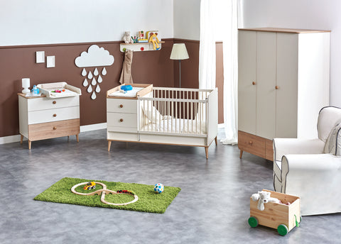 crib with changing table in nursery