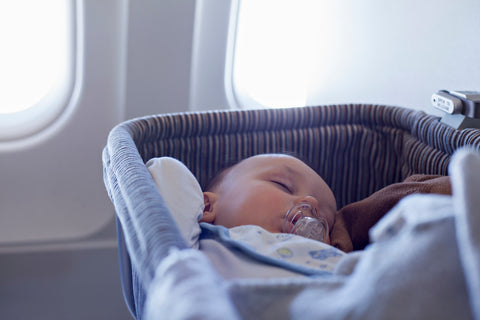 baby sleeping while flying