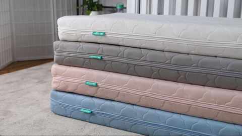 Stack of Newton kid mattresses