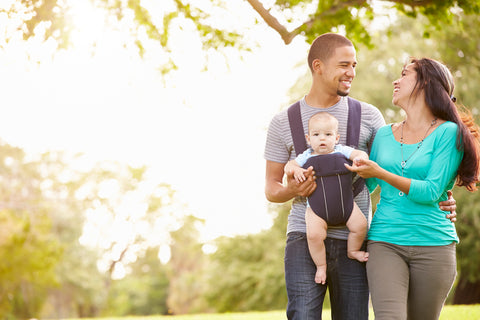 Mom and dad with baby outside