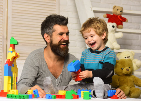 Dad playing legos with son