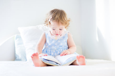 Toddler looking at a book
