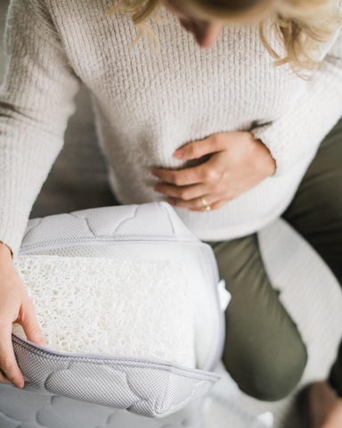 pregnant woman with a breathable newton baby crib mattress