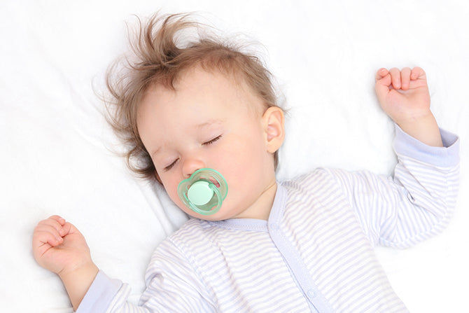 baby sleeping with pacifier