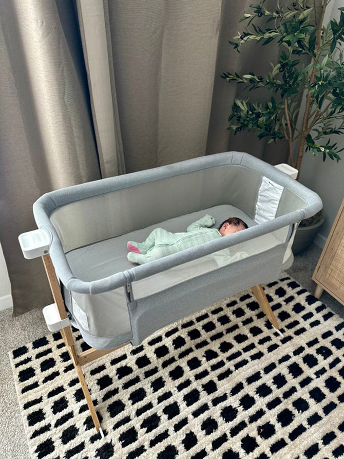 baby laying in smart bassinet