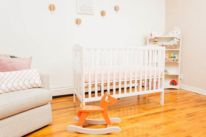 Bright nursery with crib and a rocking horse