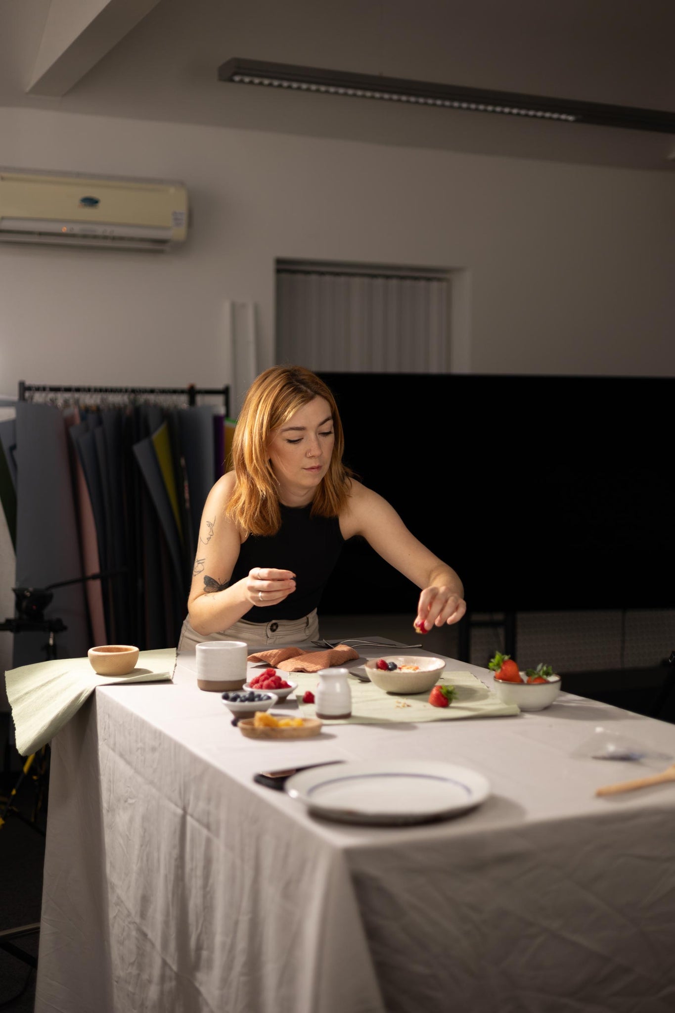 Photographer Margaux setting the tablescape