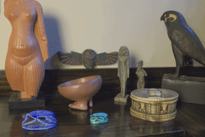 A collection of Egyptian artifacts and reproductions in the dining room.