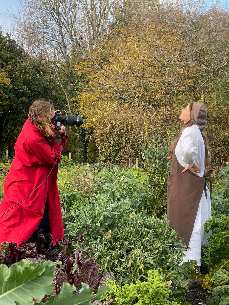 Cathy Kasterine the photographer wearing a robin coat in red wax cotton