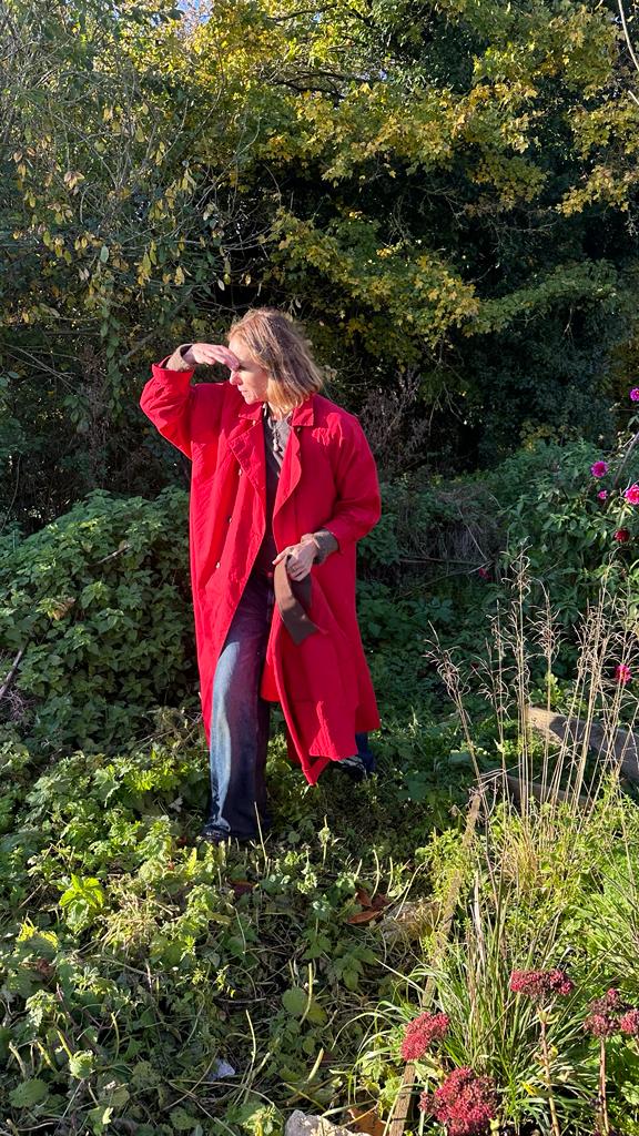 Cathy Kasterine wears the Robin coat in red wax cotton