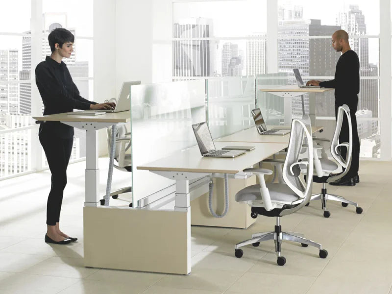 Comfy Height Adjustable Desk for Stylish Office Space with White Chairs on Grey Flooring