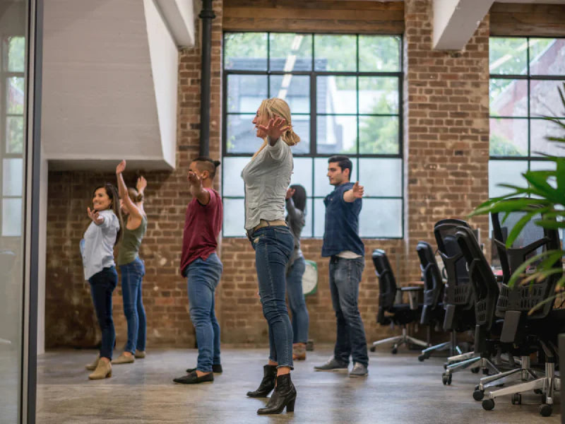 Employees Exercising in an Office Interiors