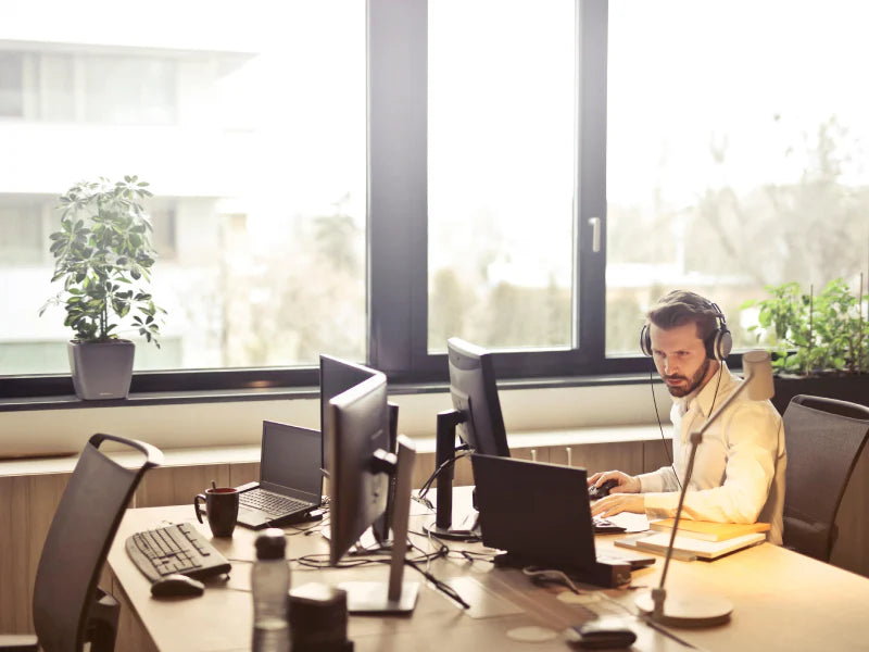 Man with Headphones Working in the Office