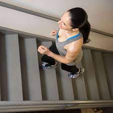 A lady running across the staircase