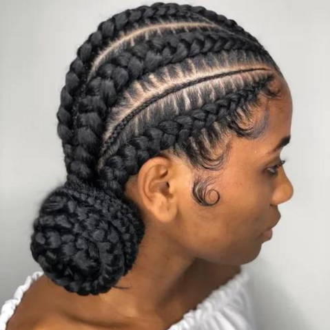 woman with cornrows styled in a bun