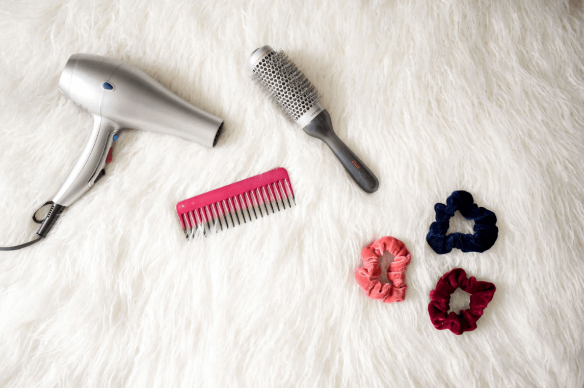 hair dryer, brush, comb, and scrunchies