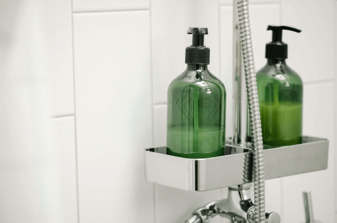 shampoo and conditioner bottles in shower
