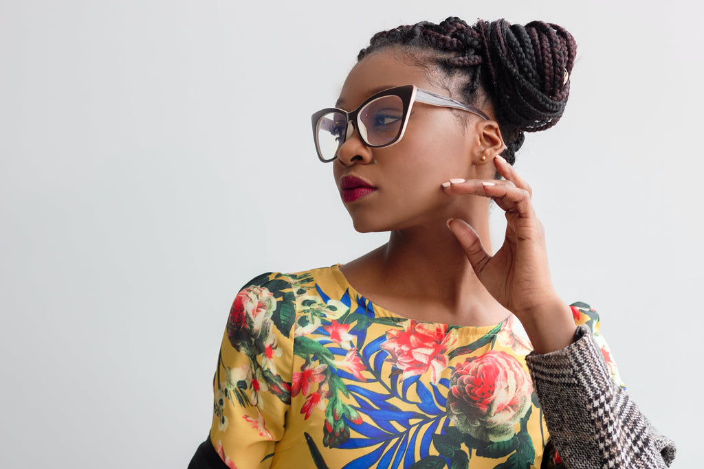 woman with a braided protective style looking to the side