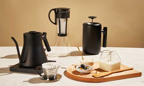 Different types of coffee brewers on a tabletop.