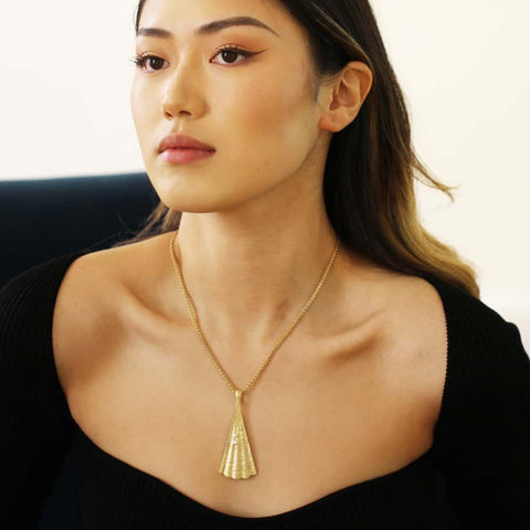 Model wears Martina Hamilton large Shore necklace in 9k gold - availalble from designyard contemporary jewellery gallery Dublin Ireland