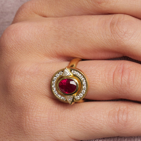 Model wears 18k Yellow Gold Surround Burmese Ruby Trillion Diamond Ring