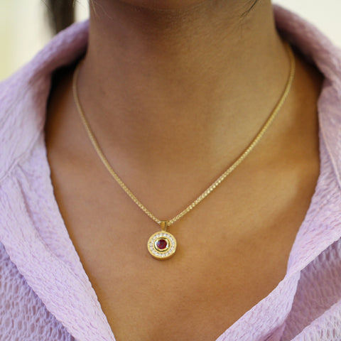 Model wears Rudolf Heltzel 18k Yellow Gold Ruby Diamond Necklace