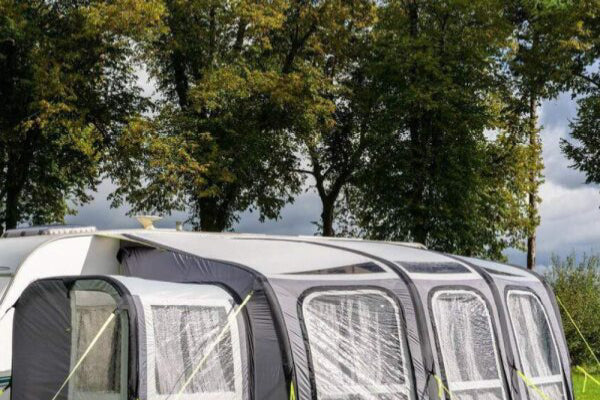 Olpro View 420 Caravan Awning with an extension in a field