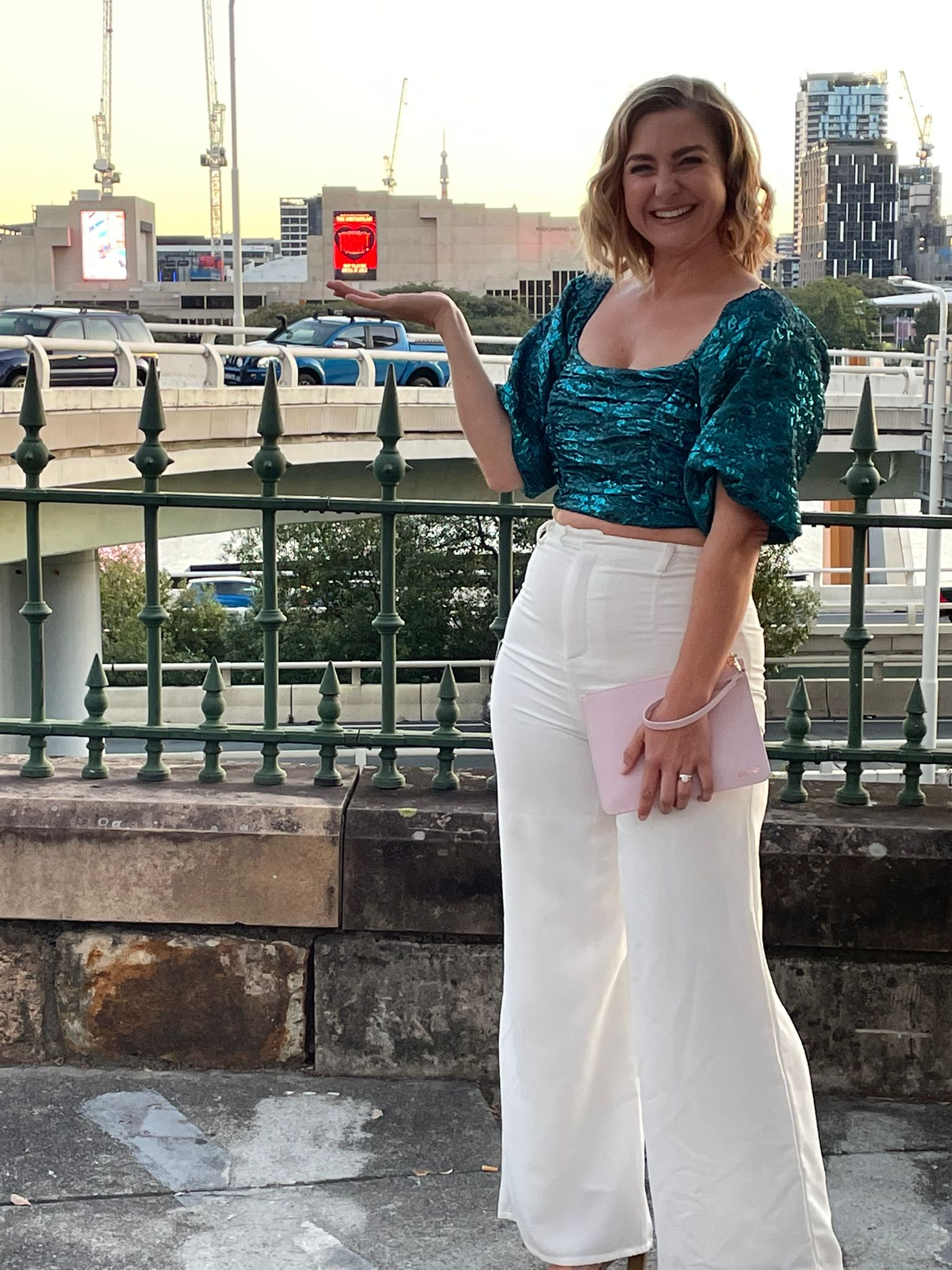 mum-smiling-in-city-wearing-second-hand-clothes