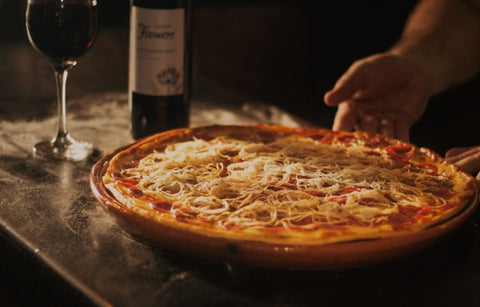 A Picture of Pizza and Wine Combination