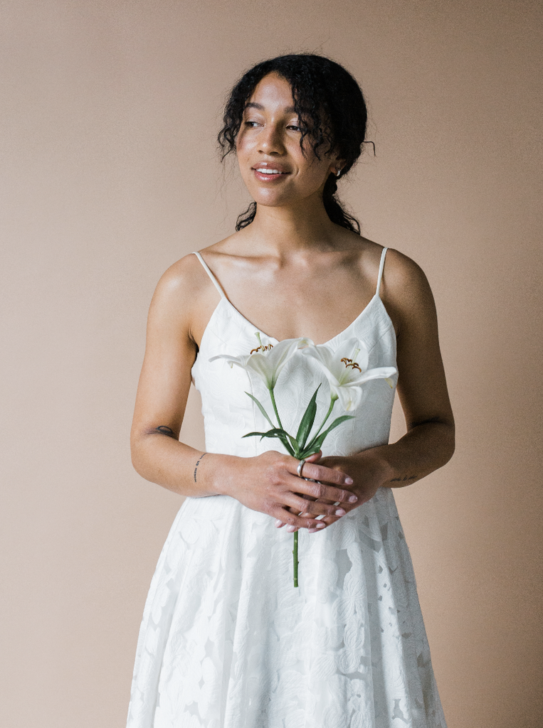 bride holding sustainable flower wedding bouquet