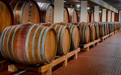 oak barrels at the Tessari Winery