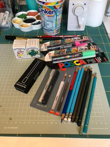 a table full of art supplies