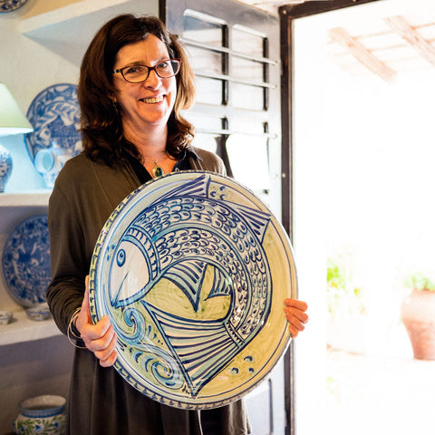 Juliet Swift holding a large dish