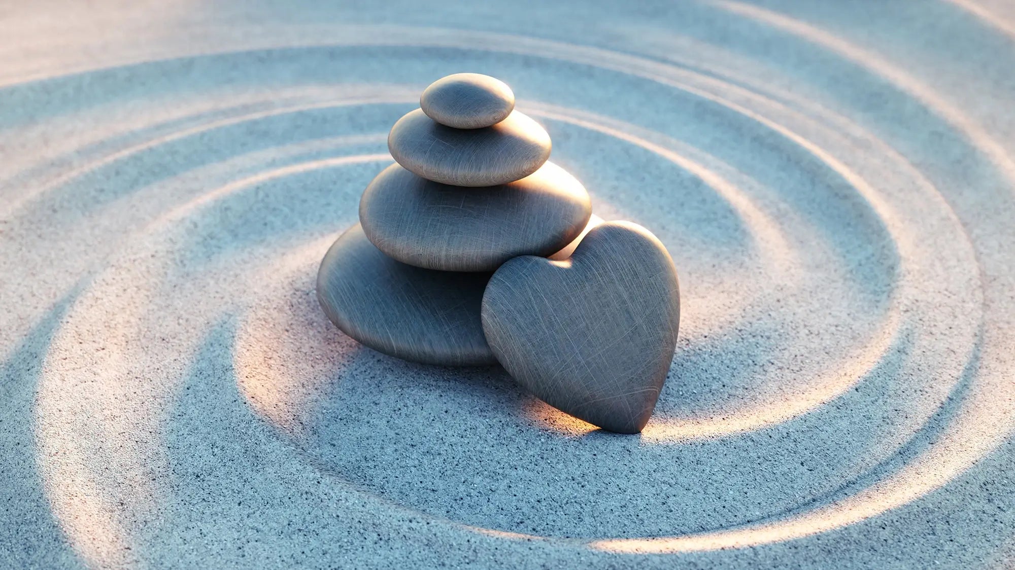 a heart shaped pebble leaning on other pebbles