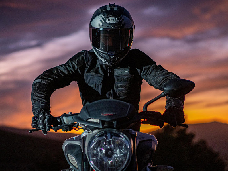 Sunset, motorcyclist in front