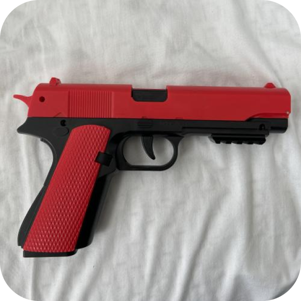 Red and black handgun on a white background.