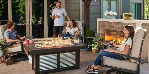 The Outdoor Greatroom Denali Brew Linear Gas Fire Pit Table At the Terrace with Family with Clear Tempered Fire Glass Gems plus Fire Burner On and Glass Wind Guard